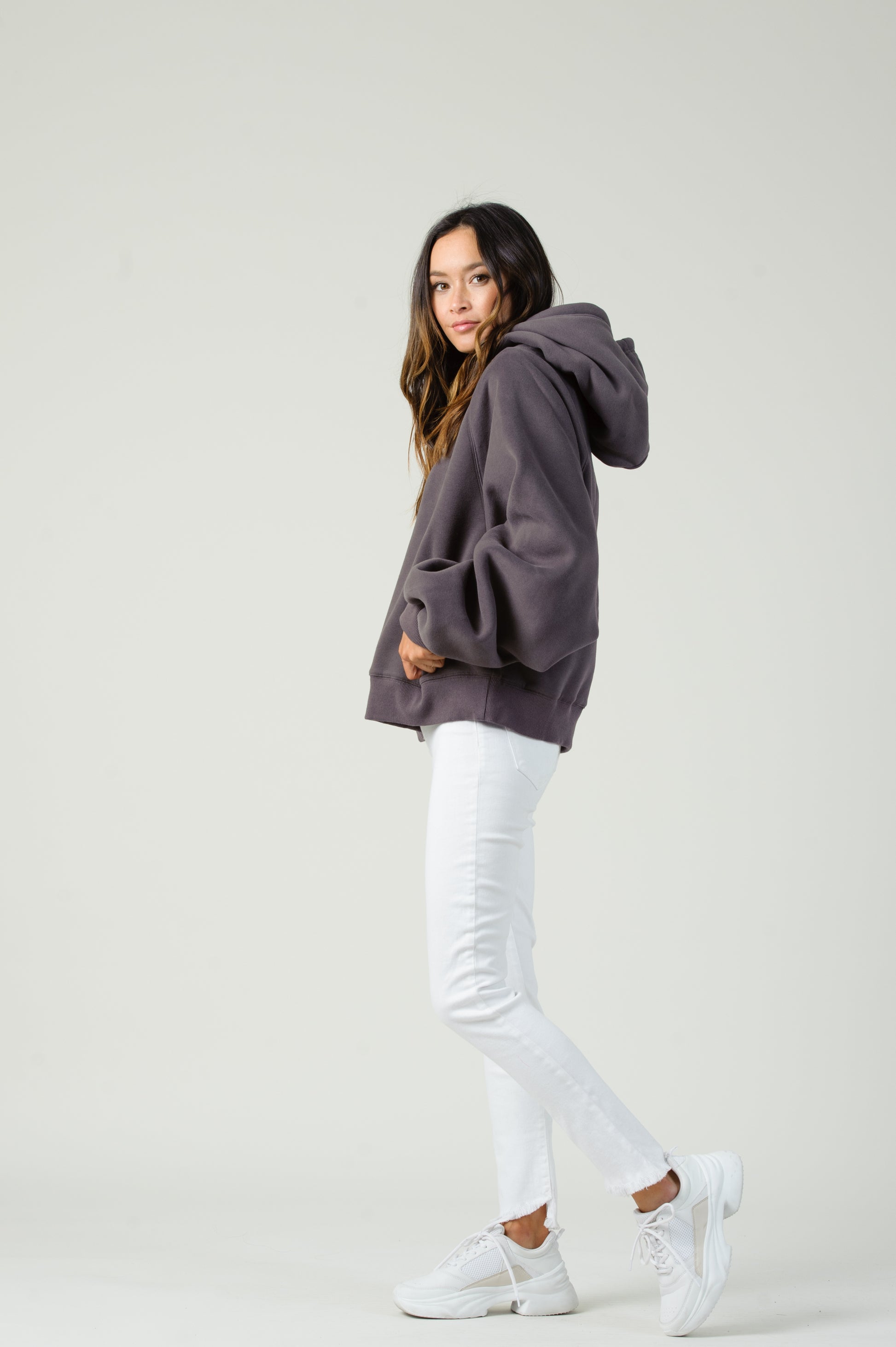 Side view of women's Gray fleece hooded sweatshirt